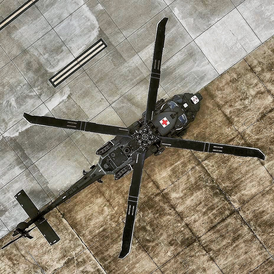 Army medevac Black Hawk with red cross markings seen from directly above on the ramp