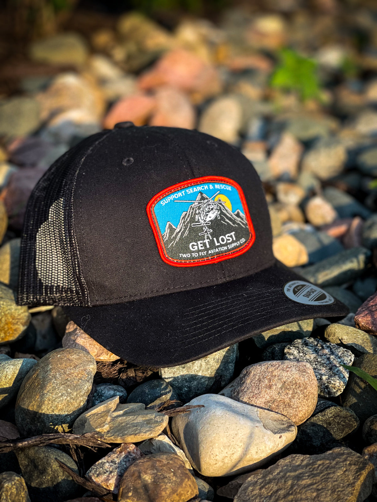 Get Lost V2 black snapback trucker cap with woven Support Search & Rescue patch