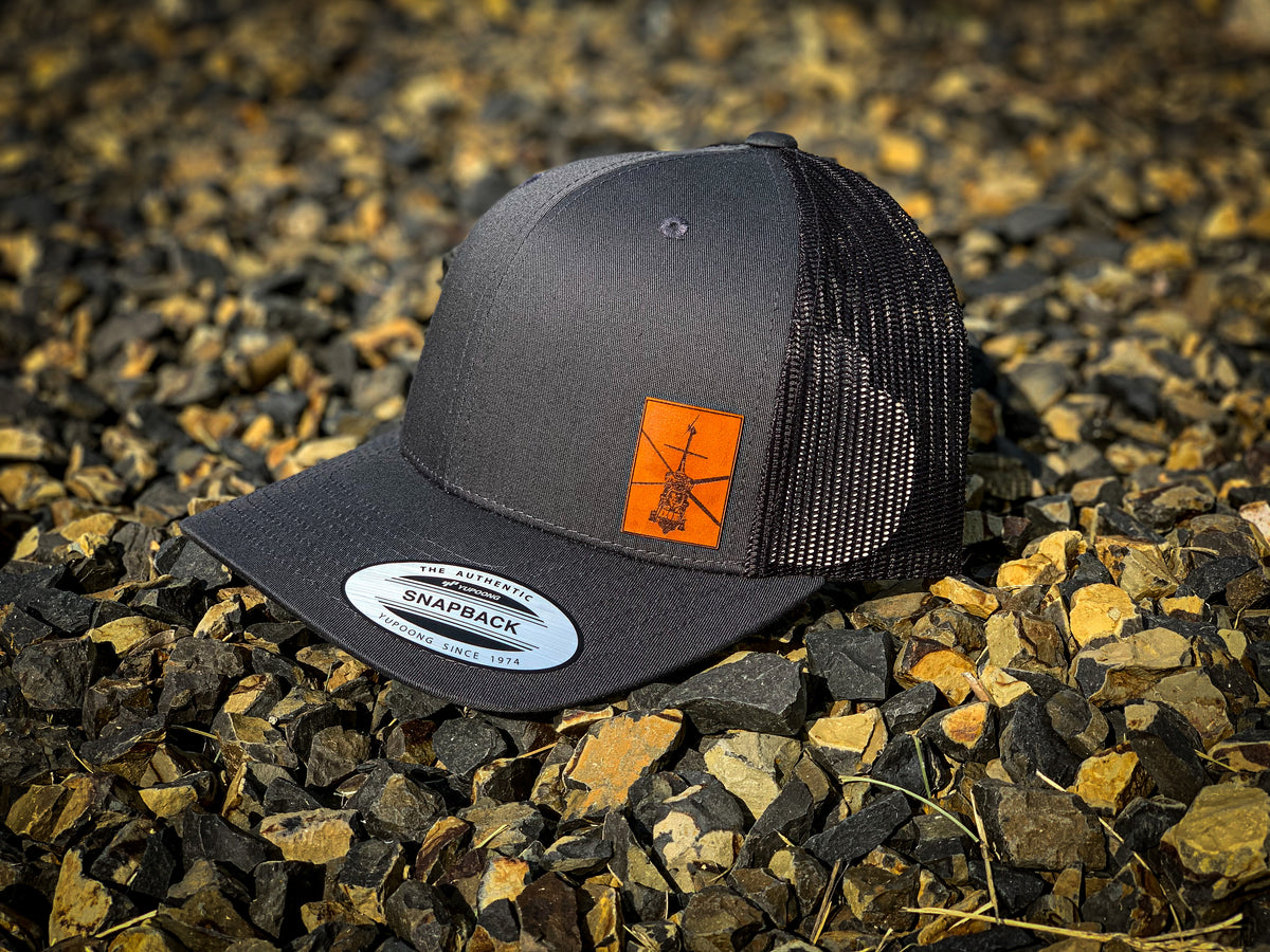 UH-60 Black Hawk snapback cap, flat lay